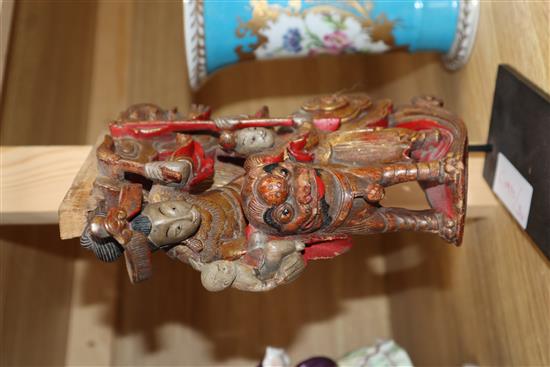 A Chinese gilt and red lacquered carving of figures, on stand length 20cm excl. stand